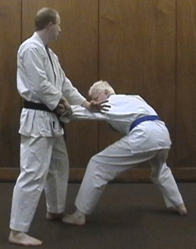 'Downward Sweep' used as an armlock to drive the opponent to the ground